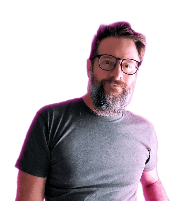 A portrait of Jamison, a bearded man wearing glasses and a black t-shirt, standing confidently. The image is highlighted with a soft purple glow, giving it a modern and creative touch, reflecting his role as a design expert.